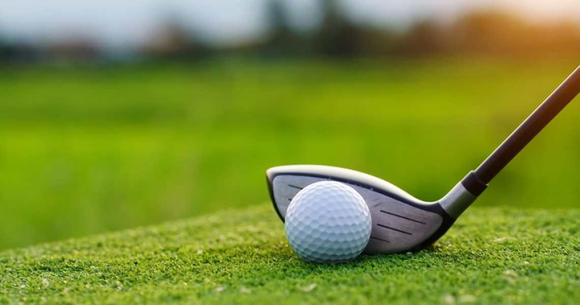 Golf,Balls,On,The,Golf,Course,With,Golf,Clubs,Ready